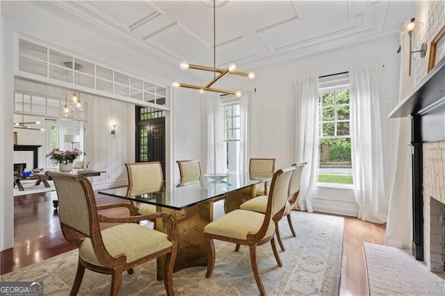 4356 N Buckhead Dr NE, Atlanta, GA 30342 - dining room with a fireplace, healthy amount of natural light, a chandelier, coffered ceiling, and ornamental molding