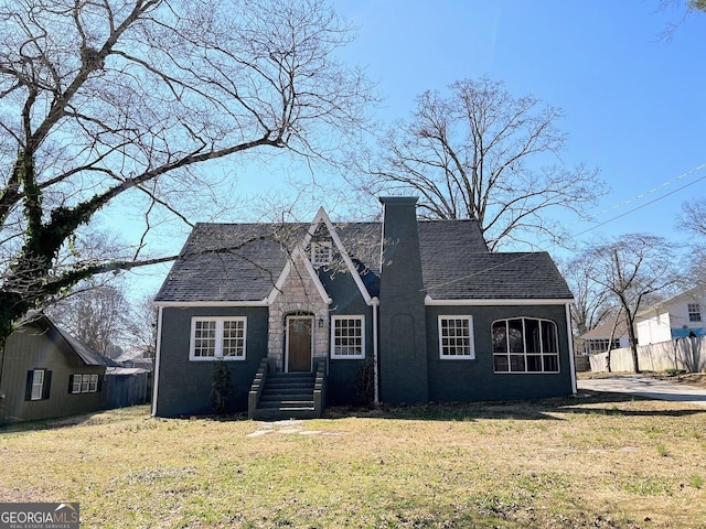 125 Oak Ave, Carrollton, GA 30117 - english style home with roof with shingles, a chimney, and stone siding
