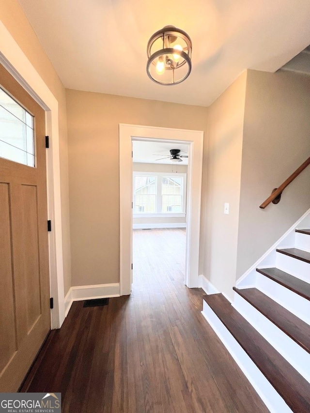 125 Oak Ave, Carrollton, GA 30117 - entryway featuring dark wood-type flooring, baseboards, stairway, and a chandelier