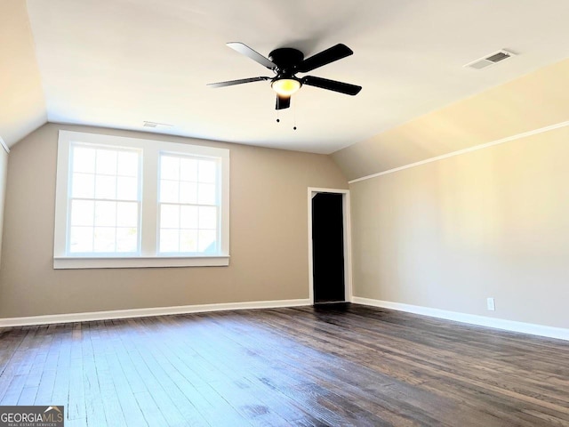 125 Oak Ave, Carrollton, GA 30117 - empty room with vaulted ceiling, dark wood-style floors, baseboards, and ceiling fan