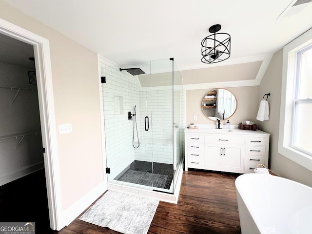 125 Oak Ave, Carrollton, GA 30117 - full bathroom featuring a shower stall, a soaking tub, vanity, and wood finished floors
