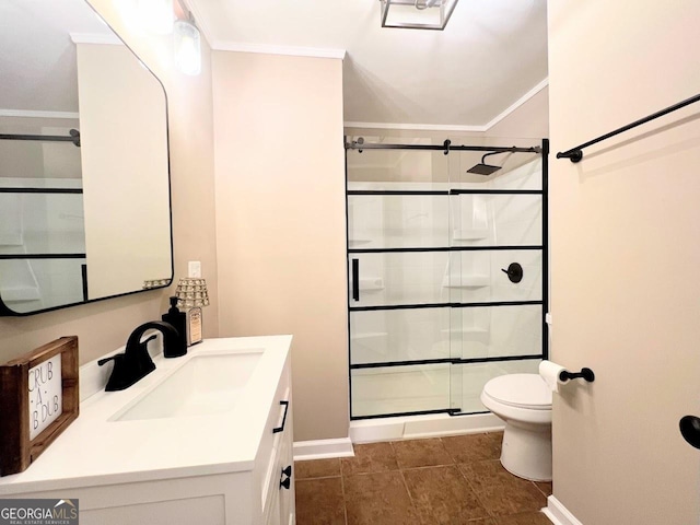 125 Oak Ave, Carrollton, GA 30117 - bathroom featuring toilet, vanity, ornamental molding, a shower stall, and baseboards