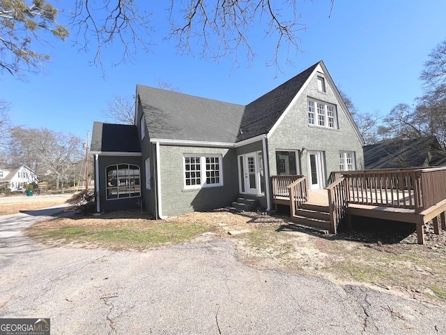 125 Oak Ave, Carrollton, GA 30117 - back of house with brick siding, a deck, and a shingled roof
