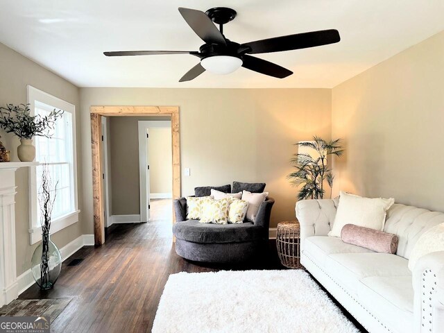 125 Oak Ave, Carrollton, GA 30117 - living room with dark wood finished floors, a ceiling fan, and baseboards