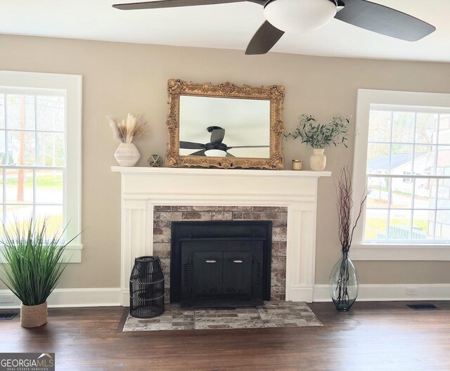 125 Oak Ave, Carrollton, GA 30117 - detailed view of ceiling fan, a fireplace, wood finished floors, and baseboards