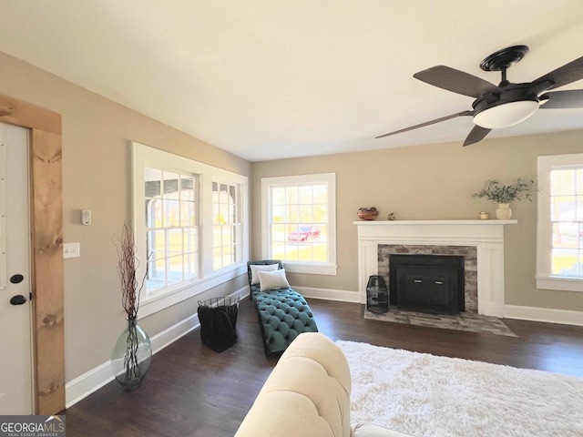 125 Oak Ave, Carrollton, GA 30117 - living room with a fireplace with flush hearth, wood finished floors, baseboards, and ceiling fan