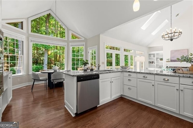 3600 Goldenrod Dr, Alpharetta, GA 30005 - kitchen featuring stainless steel dishwasher, high vaulted ceiling, a chandelier, light stone counters, and dark wood-type flooring