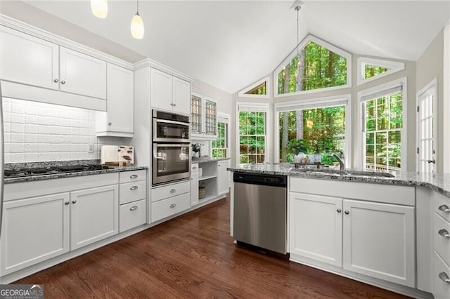 3600 Goldenrod Dr, Alpharetta, GA 30005 - kitchen with stainless steel appliances, a sink, white cabinetry, light stone countertops, and dark wood-type flooring
