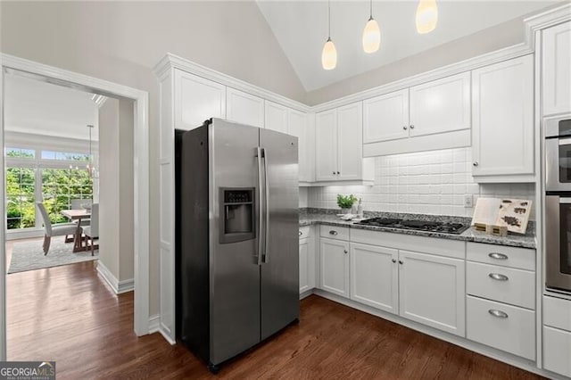 3600 Goldenrod Dr, Alpharetta, GA 30005 - kitchen featuring stainless steel appliances, white cabinetry, dark wood-type flooring, backsplash, and dark stone counters