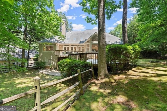 3600 Goldenrod Dr, Alpharetta, GA 30005 - rear view of house with a wooden deck and a chimney