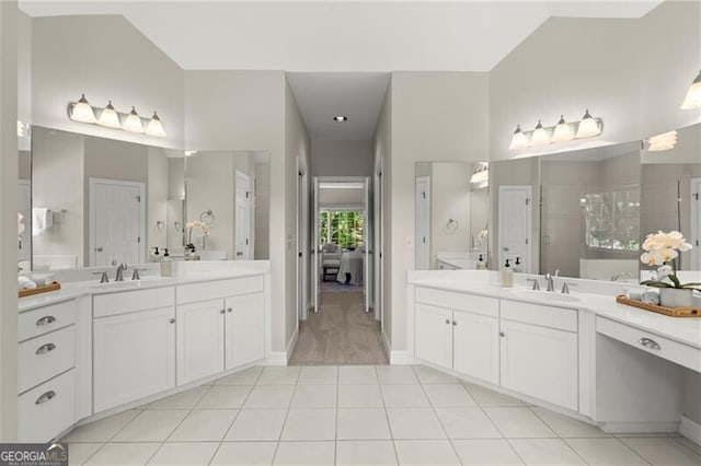 3600 Goldenrod Dr, Alpharetta, GA 30005 - full bath with two vanities, tiled shower, tile patterned flooring, and baseboards
