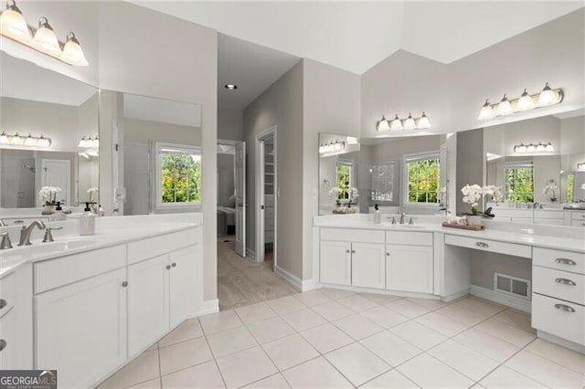 3600 Goldenrod Dr, Alpharetta, GA 30005 - full bathroom featuring two vanities, a tile shower, and tile patterned floors