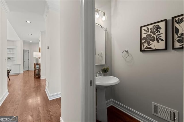 3600 Goldenrod Dr, Alpharetta, GA 30005 - bathroom with wood finished floors, a sink, baseboards, and recessed lighting