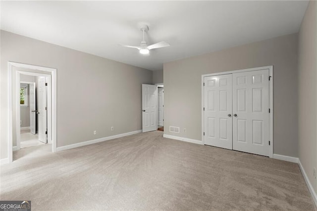 3600 Goldenrod Dr, Alpharetta, GA 30005 - unfurnished bedroom featuring light carpet, baseboards, a closet, and a ceiling fan