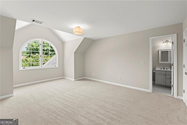 3600 Goldenrod Dr, Alpharetta, GA 30005 - additional living space featuring light carpet, lofted ceiling, baseboards, and a sink