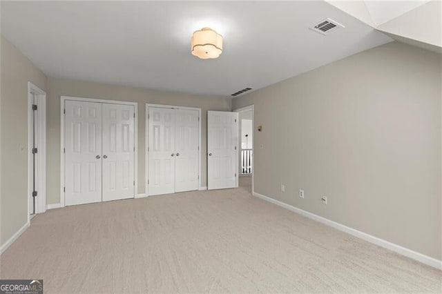 3600 Goldenrod Dr, Alpharetta, GA 30005 - unfurnished bedroom featuring carpet, two closets, and baseboards