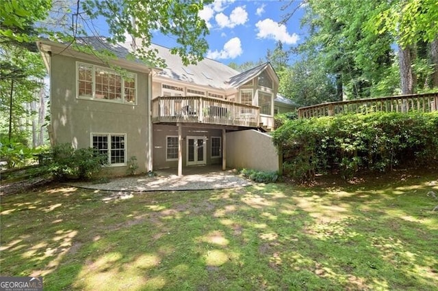 3600 Goldenrod Dr, Alpharetta, GA 30005 - back of property with a wooden deck, stucco siding, a yard, french doors, and a patio