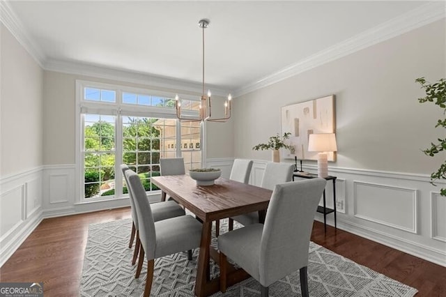 3600 Goldenrod Dr, Alpharetta, GA 30005 - dining room featuring wood finished floors, a wainscoted wall, a chandelier, ornamental molding, and a decorative wall
