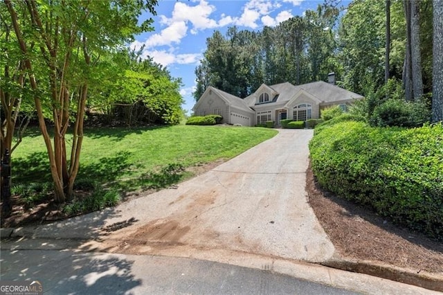 3600 Goldenrod Dr, Alpharetta, GA 30005 - view of front of home featuring a front lawn, an attached garage, a chimney, and concrete driveway