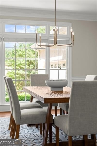3600 Goldenrod Dr, Alpharetta, GA 30005 - dining space with a chandelier, crown molding, and wood finished floors