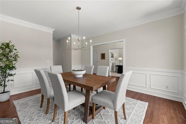3600 Goldenrod Dr, Alpharetta, GA 30005 - dining area with a chandelier, dark wood-type flooring, crown molding, a wainscoted wall, and a decorative wall