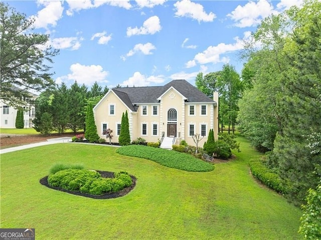 789 Rutland Ct, Lithonia, GA 30058 - colonial home featuring a front lawn and stucco siding