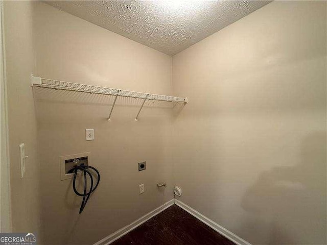124 Sparkling Spring Trl, Mcdonough, GA 30252 - washroom with washer hookup, hookup for an electric dryer, baseboards, hookup for a gas dryer, and a textured ceiling