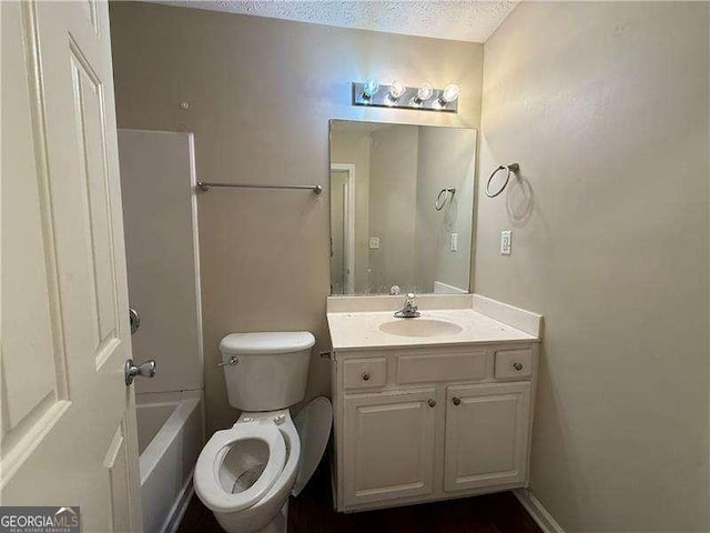 124 Sparkling Spring Trl, Mcdonough, GA 30252 - bathroom featuring vanity, toilet, shower / bathtub combination, and a textured ceiling