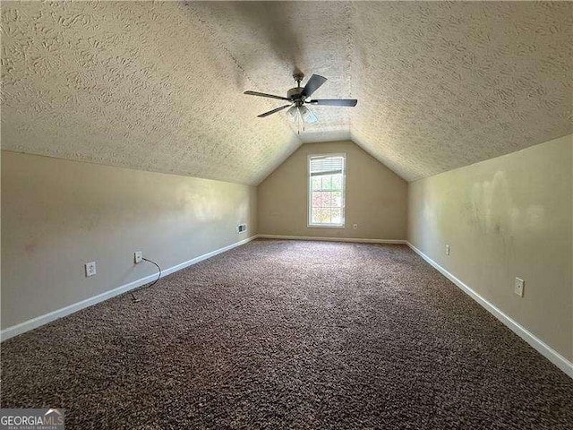 124 Sparkling Spring Trl, Mcdonough, GA 30252 - bonus room with a textured ceiling, vaulted ceiling, ceiling fan, carpet flooring, and baseboards
