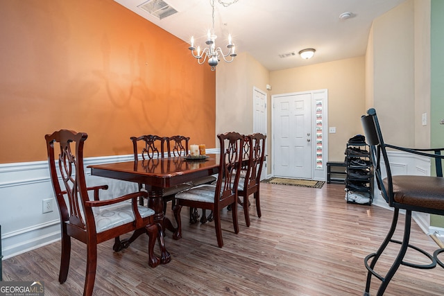 129 Finsbury Ln, Woodstock, GA 30188 - dining room featuring wood finished floors and a chandelier