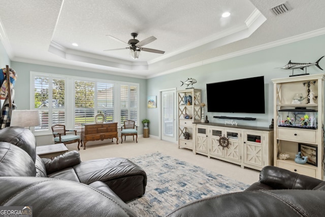 247 Laurel Landing Blvd, Kingsland, GA 31548 - living room with a raised ceiling, a ceiling fan, a textured ceiling, crown molding, and light colored carpet