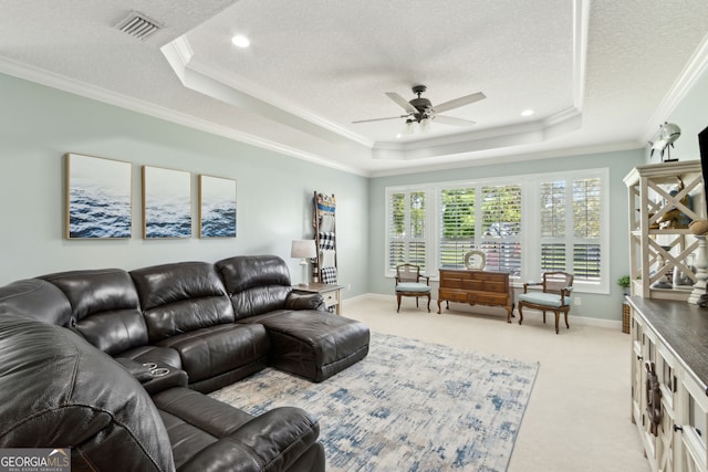 247 Laurel Landing Blvd, Kingsland, GA 31548 - living area featuring a tray ceiling, a textured ceiling, ceiling fan, light carpet, and ornamental molding