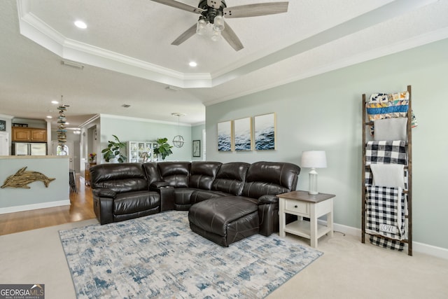 247 Laurel Landing Blvd, Kingsland, GA 31548 - living area featuring a tray ceiling, crown molding, ceiling fan, recessed lighting, and baseboards