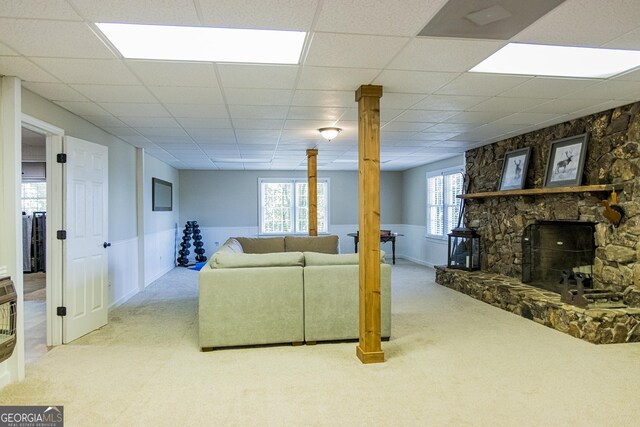 11 Brow Rd SW, Rome, GA 30165 - living area with carpet floors, wainscoting, a paneled ceiling, decorative columns, and a stone fireplace