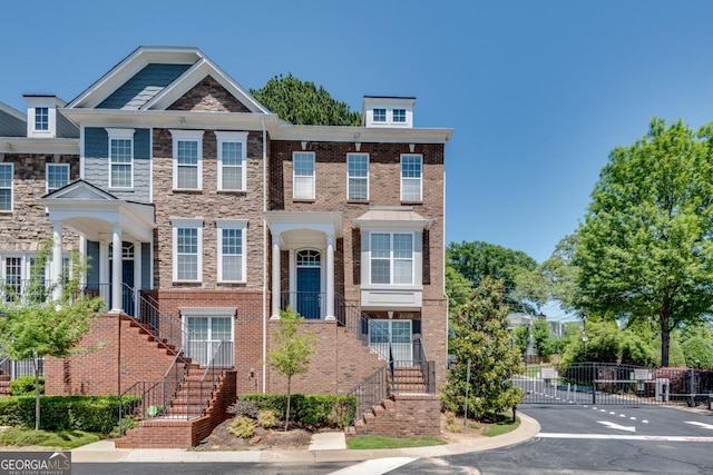 2325 Limehurst Dr NE, Atlanta, GA 30319 - view of property with stairway, a gate, and stone siding