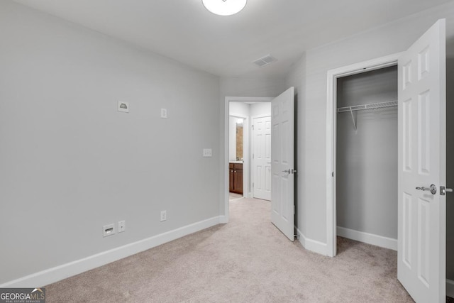 2325 Limehurst Dr NE, Atlanta, GA 30319 - unfurnished bedroom featuring light colored carpet, baseboards, and a closet