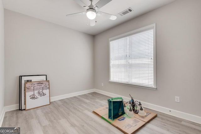 2325 Limehurst Dr NE, Atlanta, GA 30319 - spare room with light wood-style floors, a ceiling fan, and baseboards