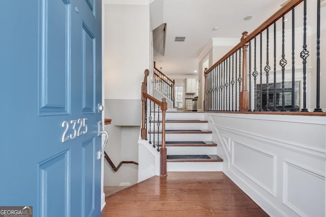 2325 Limehurst Dr NE, Atlanta, GA 30319 - foyer entrance featuring stairway, wood finished floors, and ornamental molding
