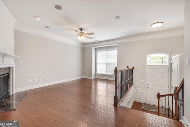 2325 Limehurst Dr NE, Atlanta, GA 30319 - unfurnished living room featuring a high end fireplace, wood finished floors, ceiling fan, and ornamental molding
