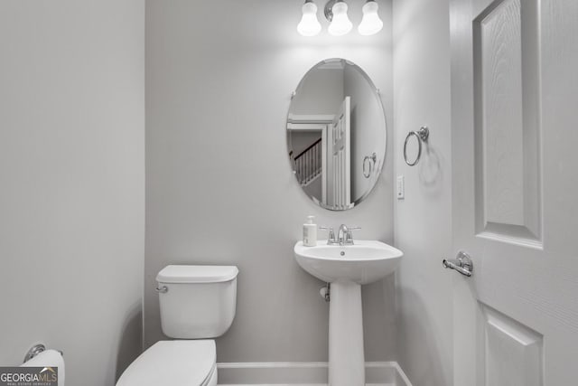 2325 Limehurst Dr NE, Atlanta, GA 30319 - half bath featuring toilet, baseboards, and a sink