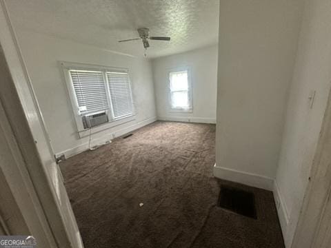 146 Carter St, Carrollton, GA 30117 - empty room with carpet, baseboards, a textured ceiling, ceiling fan, and cooling unit