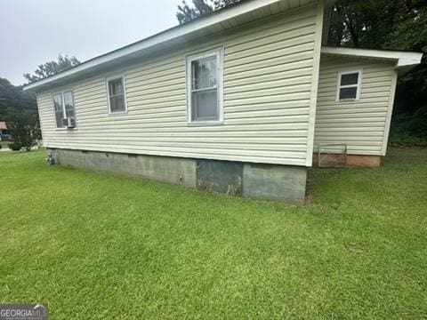 146 Carter St, Carrollton, GA 30117 - view of side of home featuring crawl space and a lawn