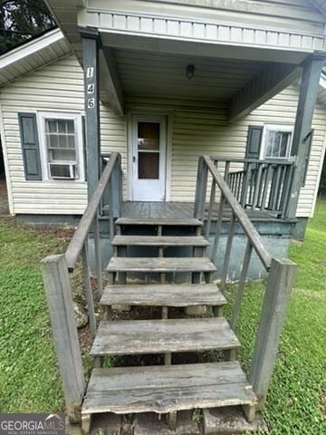 146 Carter St, Carrollton, GA 30117 - doorway to property with a yard