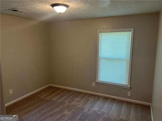 3551 Skyline Ter SW, Marietta, GA 30008 - unfurnished room featuring a textured ceiling, carpet, and baseboards
