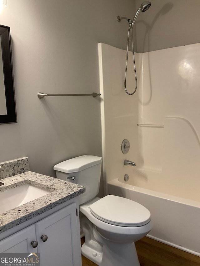 233 Winterville, Rockmart, GA 30153 - bathroom with vanity, tub / shower combination, and wood finished floors