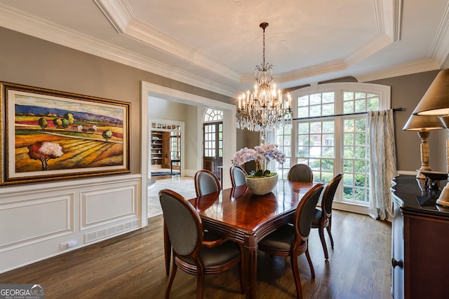 314 Caruso Ct, Sandy Springs, GA 30350 - dining area with a raised ceiling, a chandelier, dark wood-type flooring, ornamental molding, and wainscoting