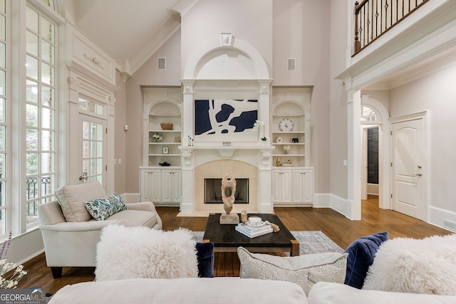 314 Caruso Ct, Sandy Springs, GA 30350 - living area featuring high vaulted ceiling, a tiled fireplace, dark wood-style floors, and ornamental molding
