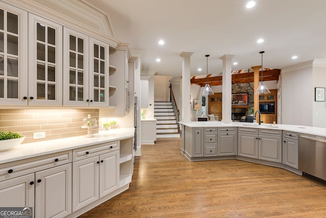 314 Caruso Ct, Sandy Springs, GA 30350 - kitchen featuring gray cabinetry, stainless steel dishwasher, glass insert cabinets, light wood-type flooring, and light countertops