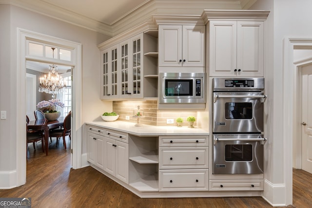 314 Caruso Ct, Sandy Springs, GA 30350 - kitchen with stainless steel appliances, open shelves, a chandelier, backsplash, and light countertops