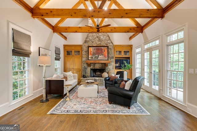 314 Caruso Ct, Sandy Springs, GA 30350 - living area featuring a stone fireplace, beam ceiling, high vaulted ceiling, and wood finished floors